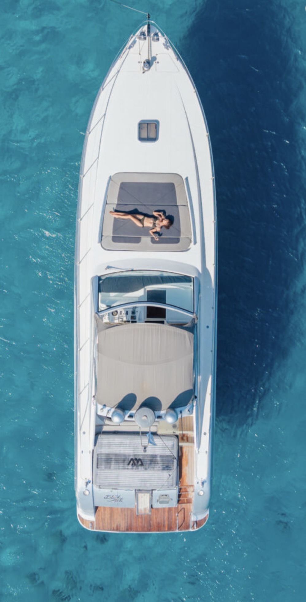 Alfamarine 50ft Open anchored in a turquoise Mykonos bay with guests swimming